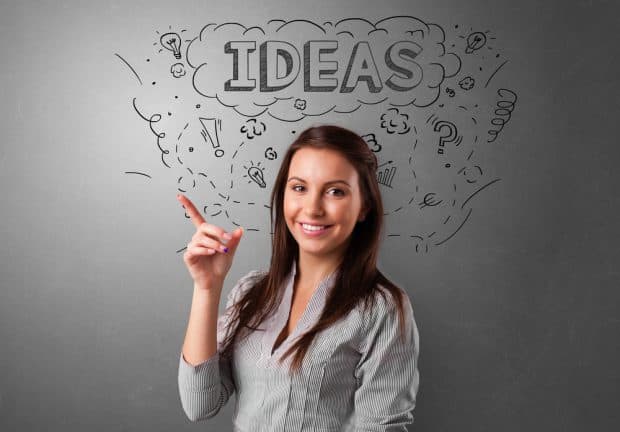 young woman with a list of great small business ideas