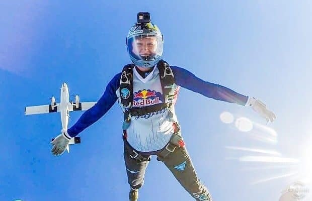 take a risk quotes image of melanie curtis on a daring adventure flying with parachute