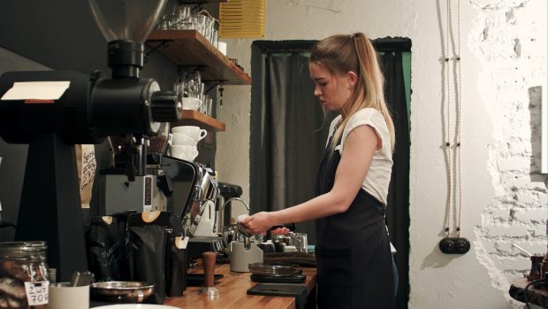 coffee shop employee opening up starbucks